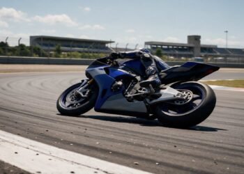 Moto de corrida azul inclinada em curva, como funciona a MotoGP