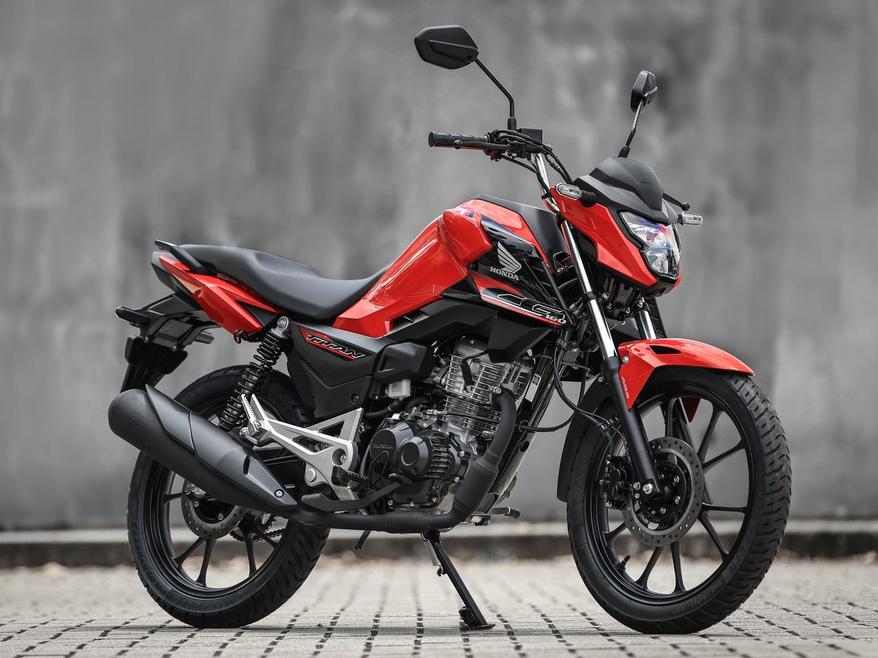 Honda Titan 2027 vermelha com rodas de liga e disco nas duas rodas